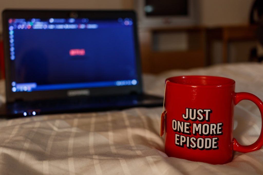 Netflix mug in front of laptop