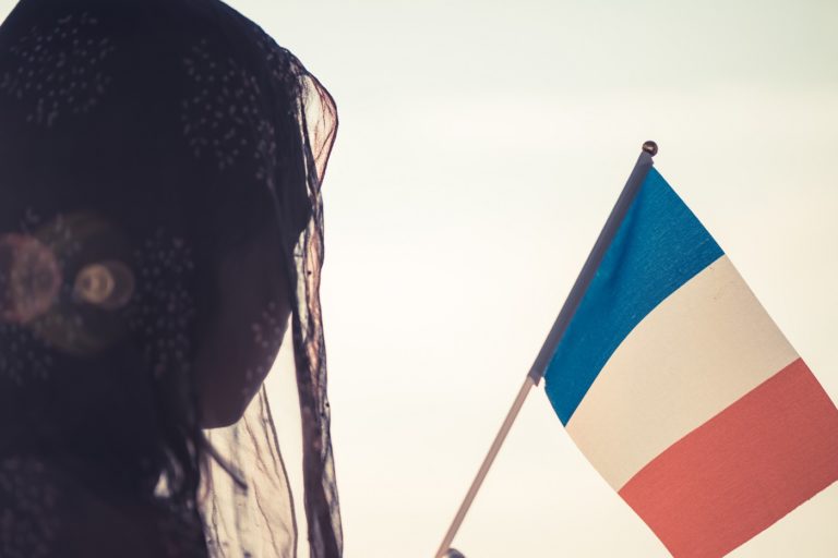Veiled Woman with French Flag