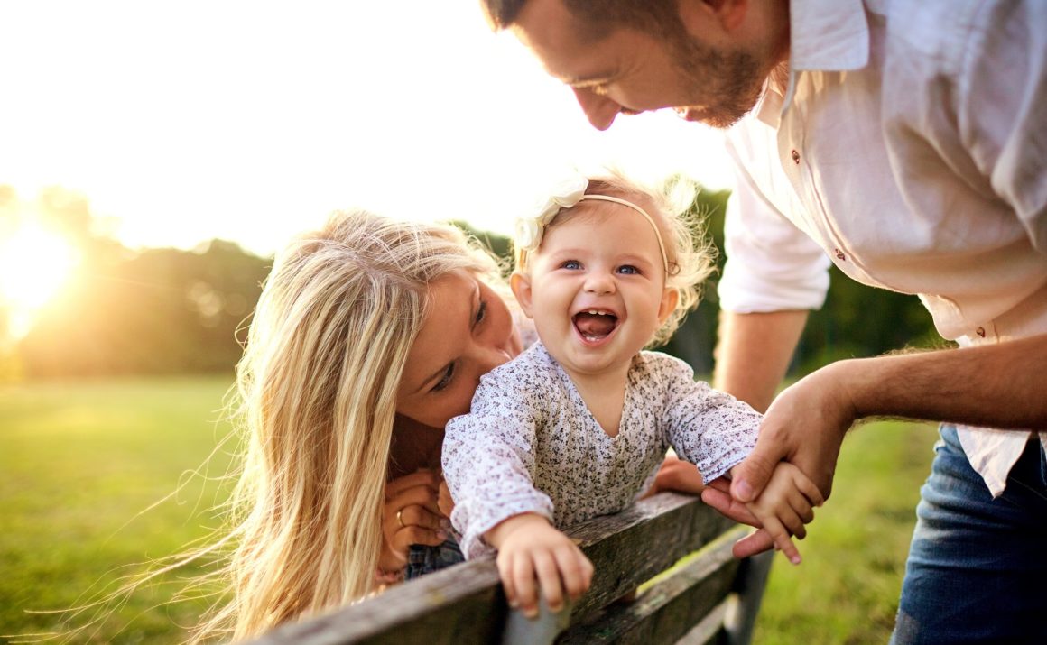 Happy family playing outside