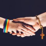 Gay and Christian person shaking hands