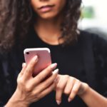 woman holding smartphone
