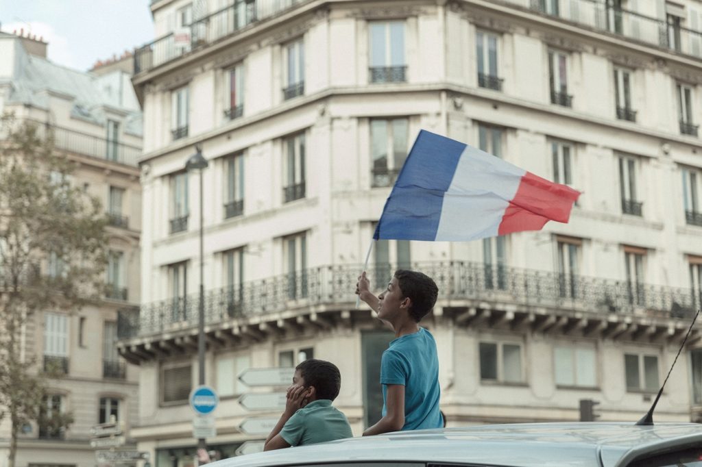 Boy waving French flag