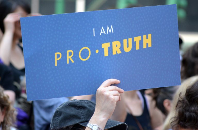 Protest sign saying "I am Pro-Truth"