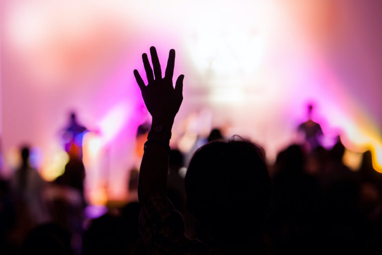 Christian praise concert with hand raised