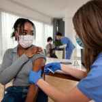 Image of woman receiving vaccine
