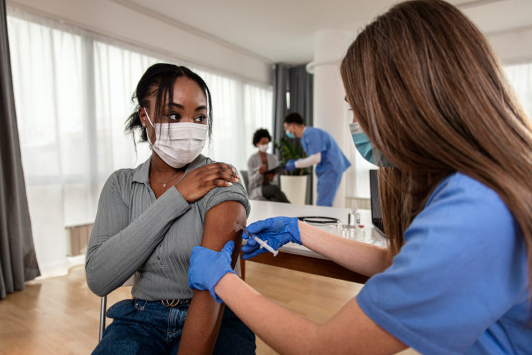 Image of woman receiving vaccine