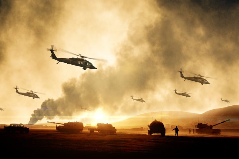 Military Helicopters flying over war zone