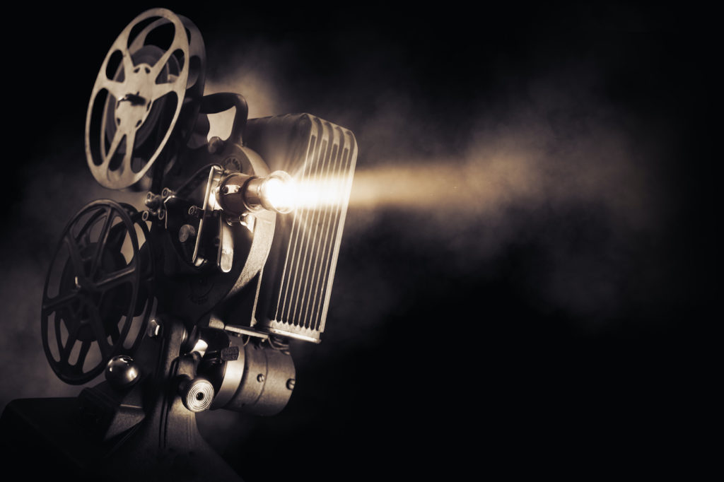 Photo of film projector against dark background