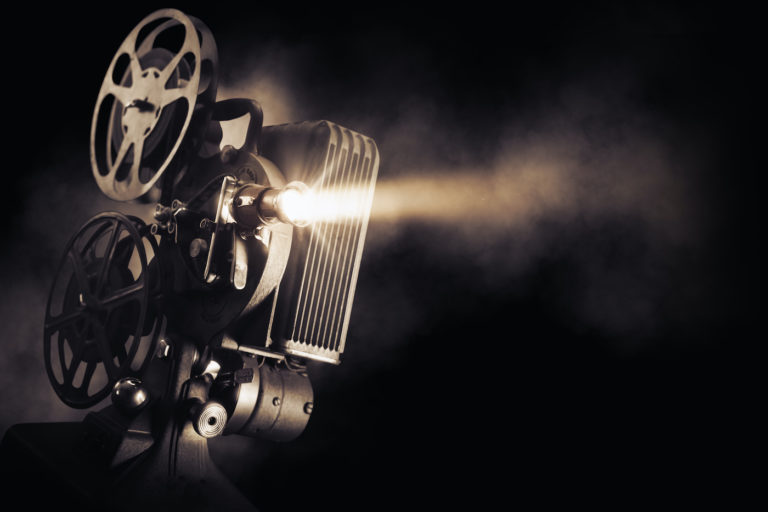 Photo of film projector against dark background