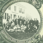 Black and white photo of large family gathered