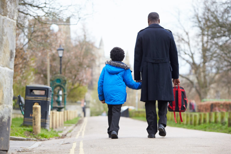 Father and Son walking to school