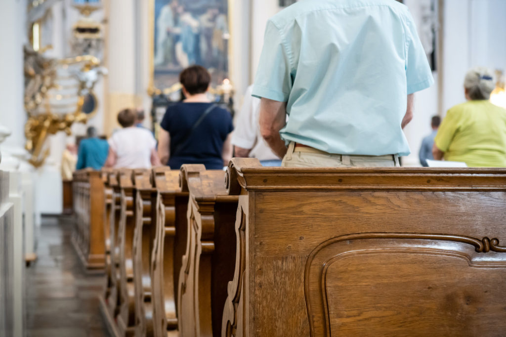 Catholics in Pew at Mass