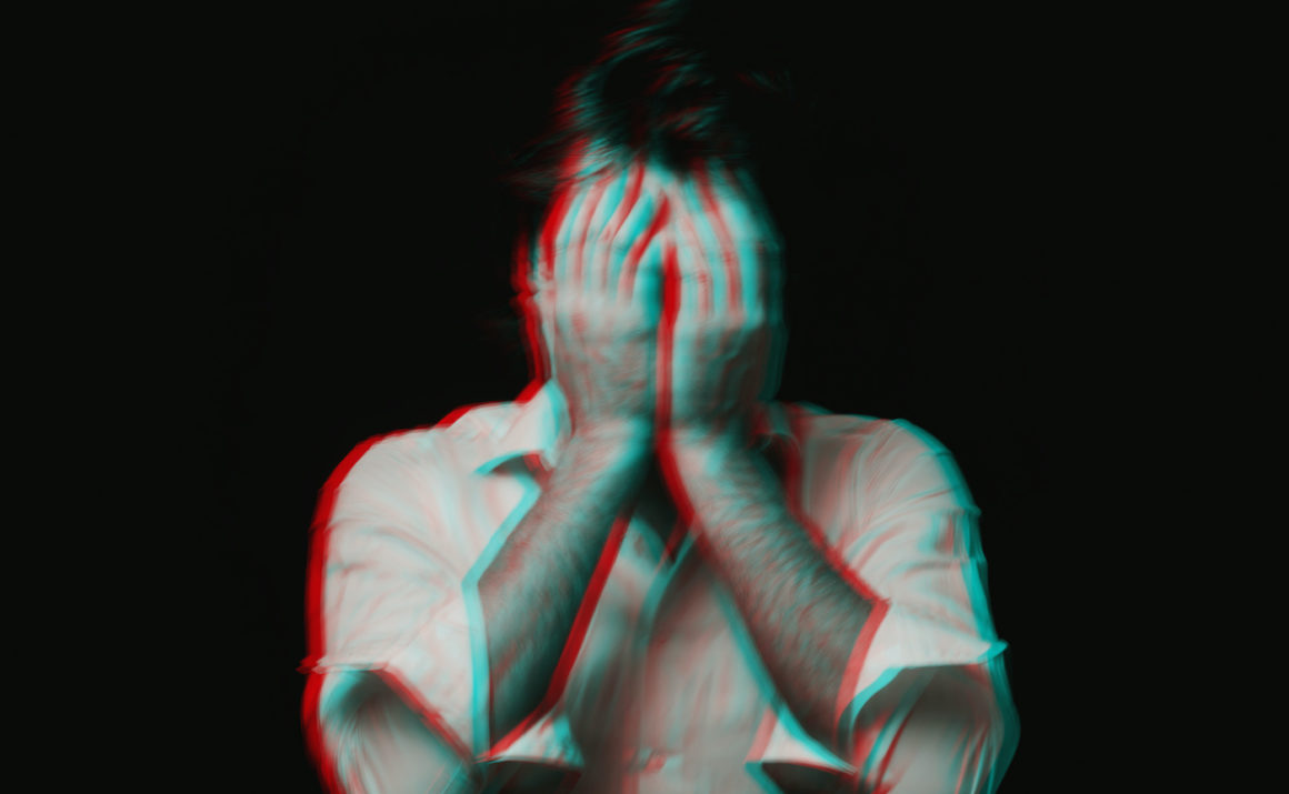Abstract blurry portrait of a depressed man with mental personality disorders