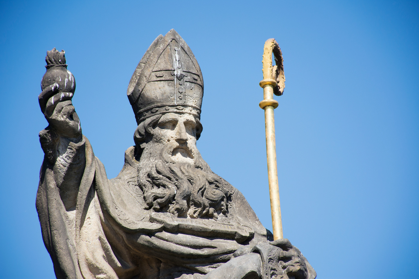 St. Augustinus or Augustine of Hippo Statue for Czechia people and foreigner travelers visit at Charles Bridge crossing Vltava river on August 30, 2017 in Prague, Czech Republic
