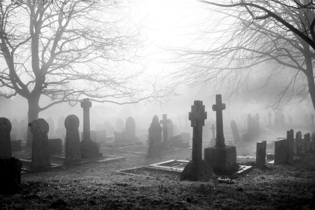An eary mist covering an English grave yard with about fifty grave stones