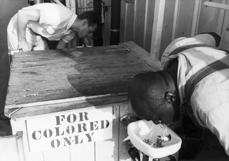 Segregated drinking fountain in use in the American South. Undated photograph. BPA2# 1135.